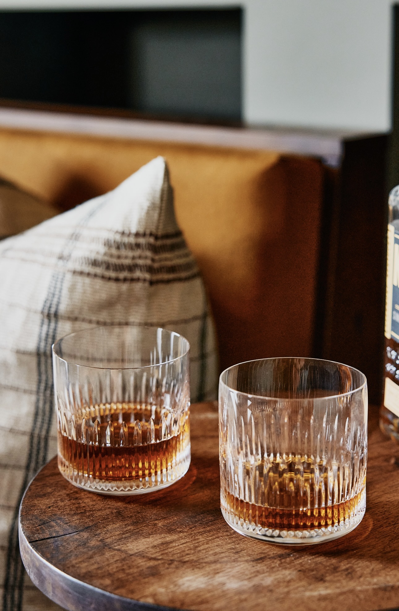 whiskey or bourbon glasses sitting on table